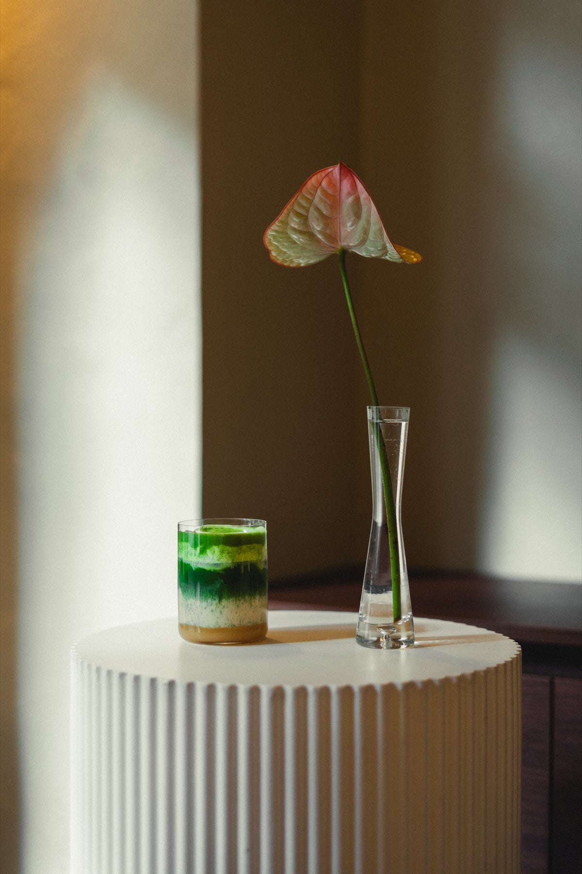 Anthurium beside a layered matcha