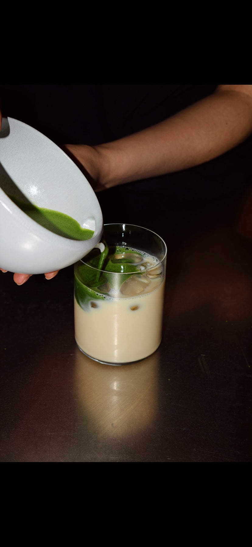 Pouring matcha into a glass
